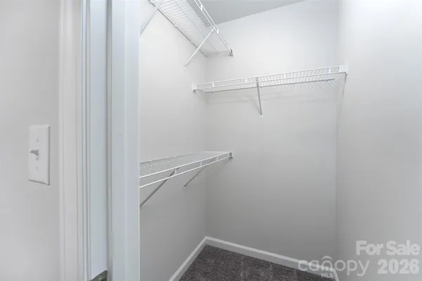 a view of a room with racks on the wall