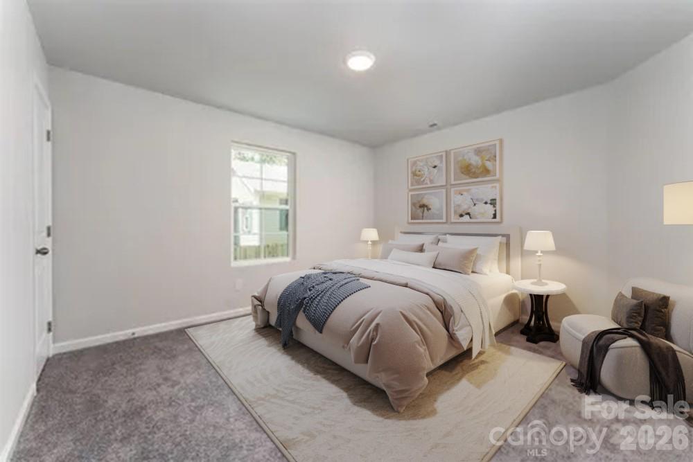 27 Forest Park Road Marion, NC 28752 - Photo 13 of 21 a spacious bedroom with two beds and a window