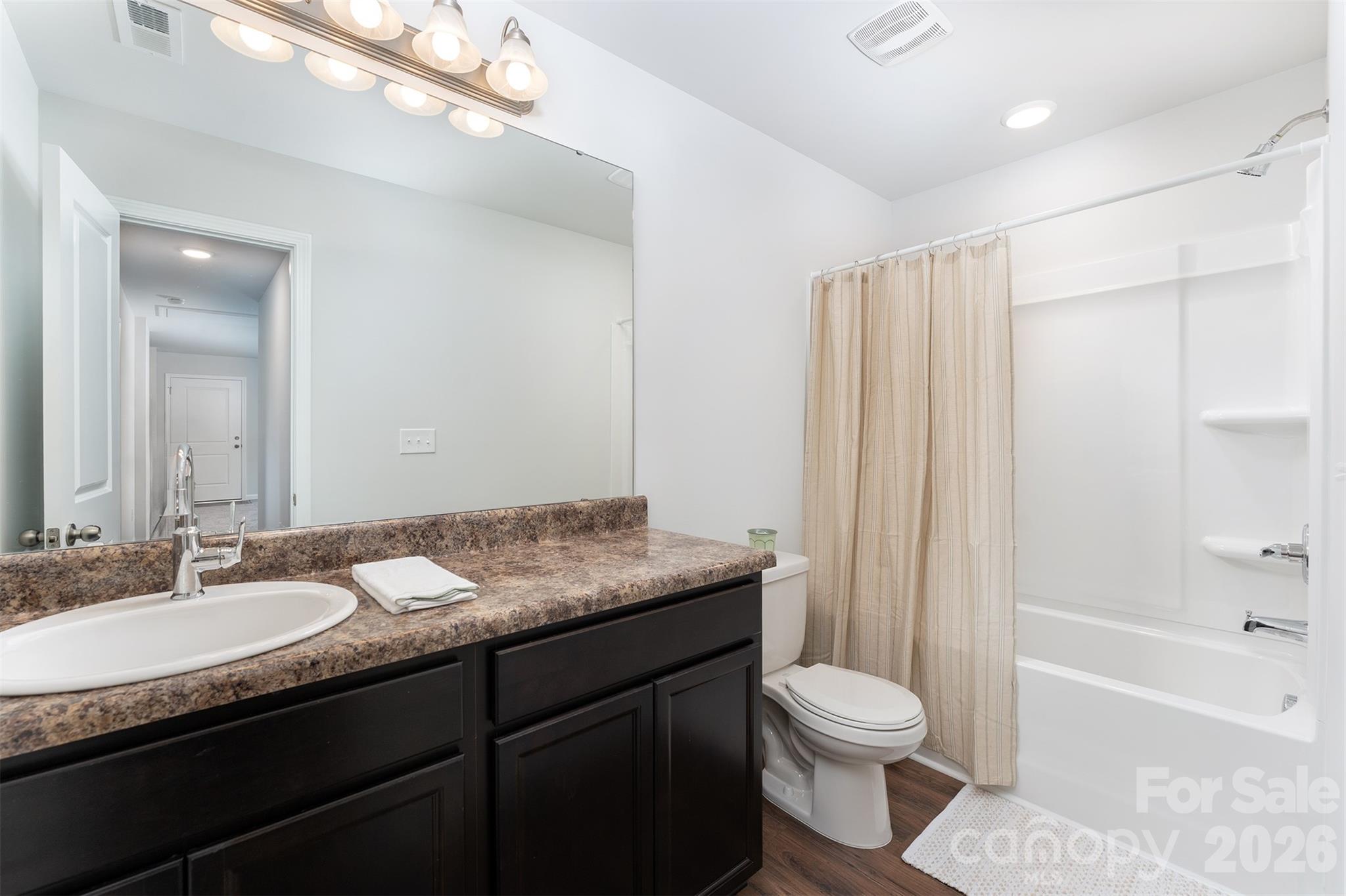 27 Forest Park Road Marion, NC 28752 - Photo 15 of 21 a bathroom with a granite countertop sink toilet and shower