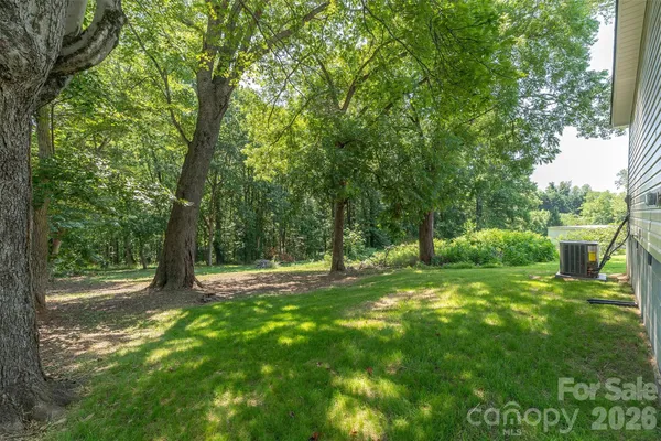 a view of outdoor space with deck and yard