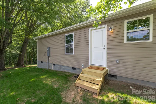 a view of a backyard with a sitting area