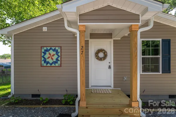 a front view of a house with a porch