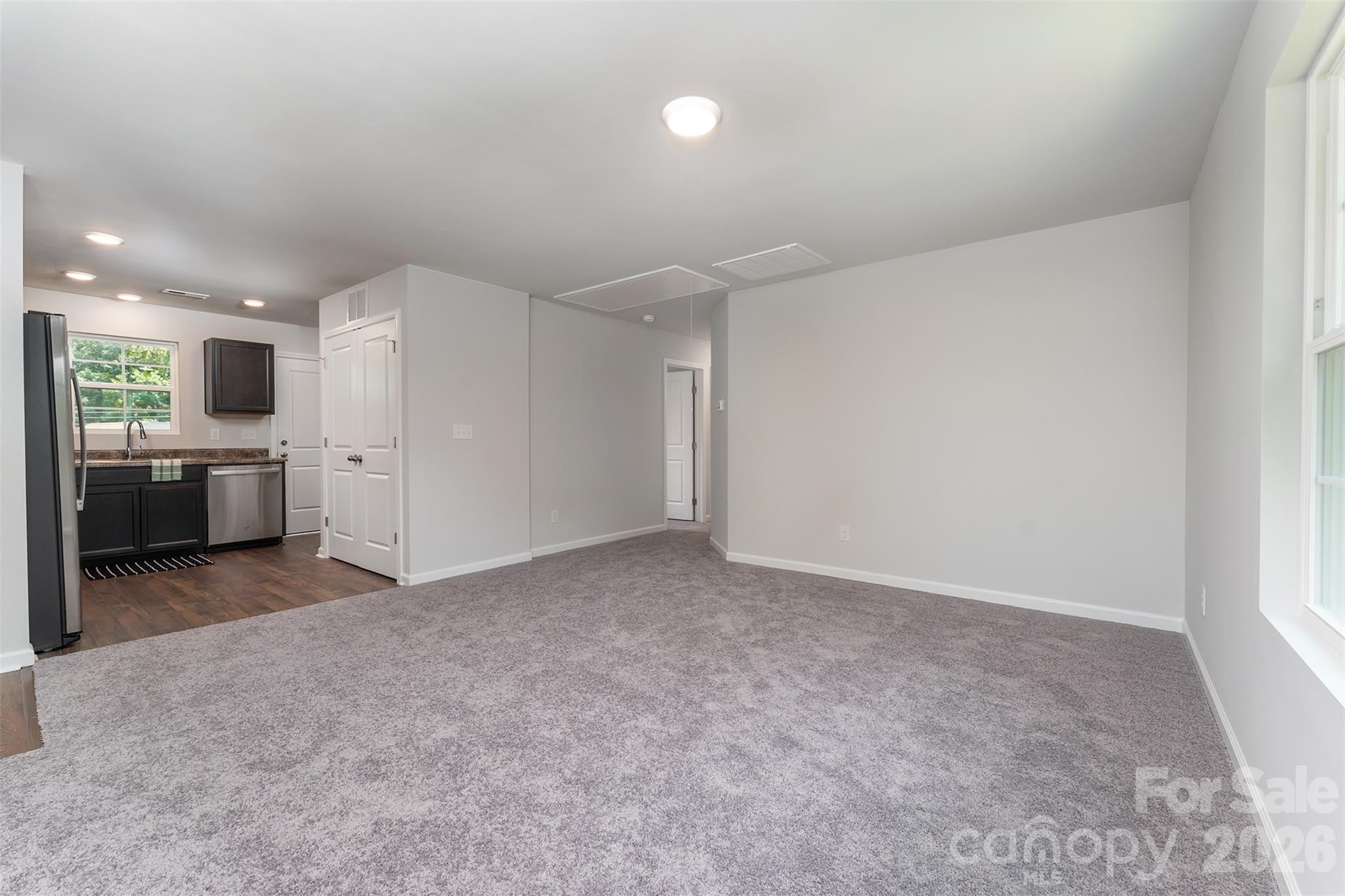 27 Forest Park Road Marion, NC 28752 - Photo 8 of 21 an empty room with a kitchen and a sink