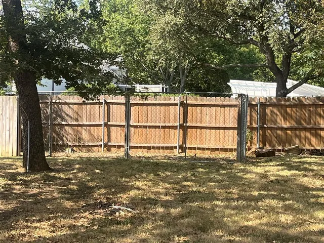 a view of a lake with houses in the back