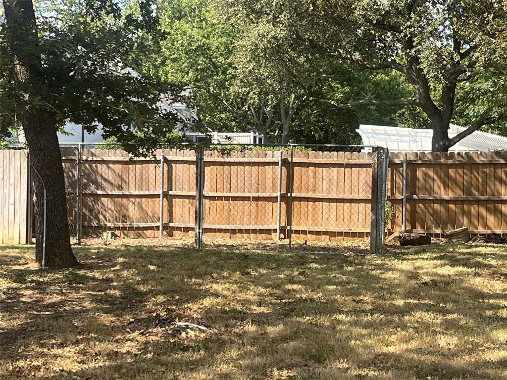 6417 Silver Wind Court Arlington, TX 76016 - Photo 14 of 18 a view of outdoor space with deck and tree around