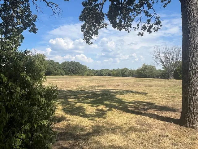 a view of a swimming pool with an outdoor seating and a garden