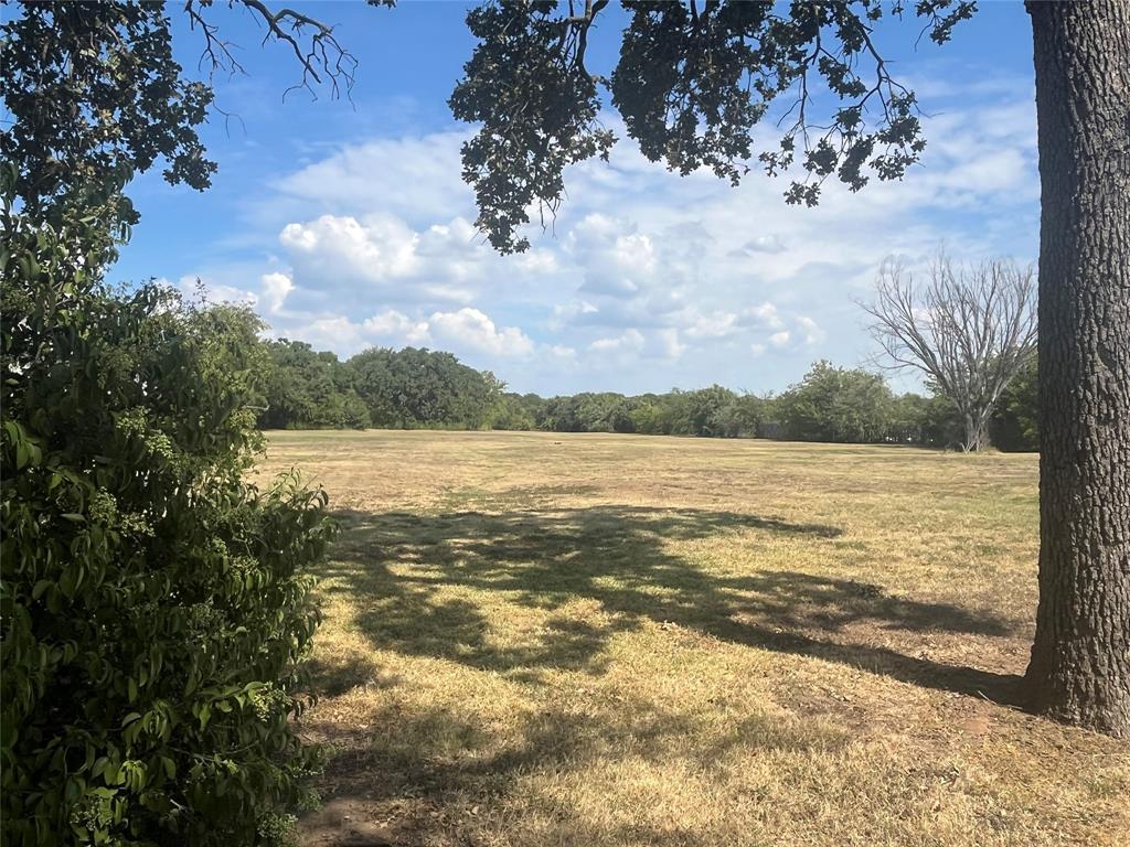 6417 Silver Wind Court Arlington, TX 76016 - Photo 15 of 18 a view of a lake with houses in the back