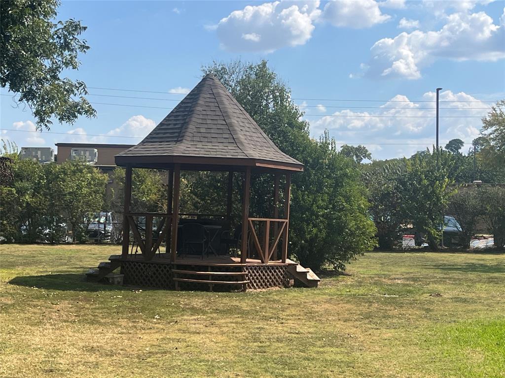 6417 Silver Wind Court Arlington, TX 76016 - Photo 16 of 18 a view of a swimming pool with an outdoor seating and a garden