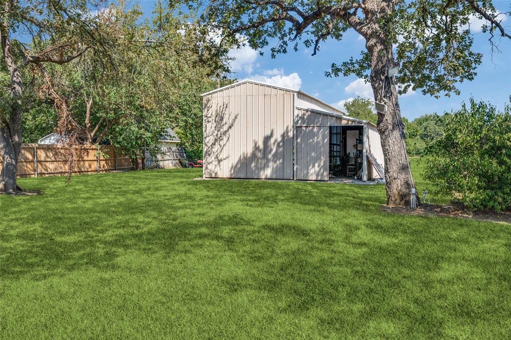 6417 Silver Wind Court Arlington, TX 76016 - Photo 17 of 18 a view of a house with a yard