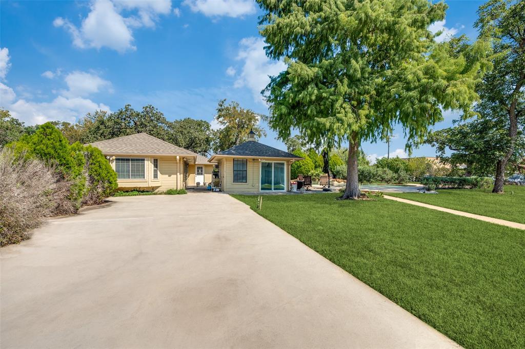 6417 Silver Wind Court Arlington, TX 76016 - Photo 18 of 18 a front view of house with a garden