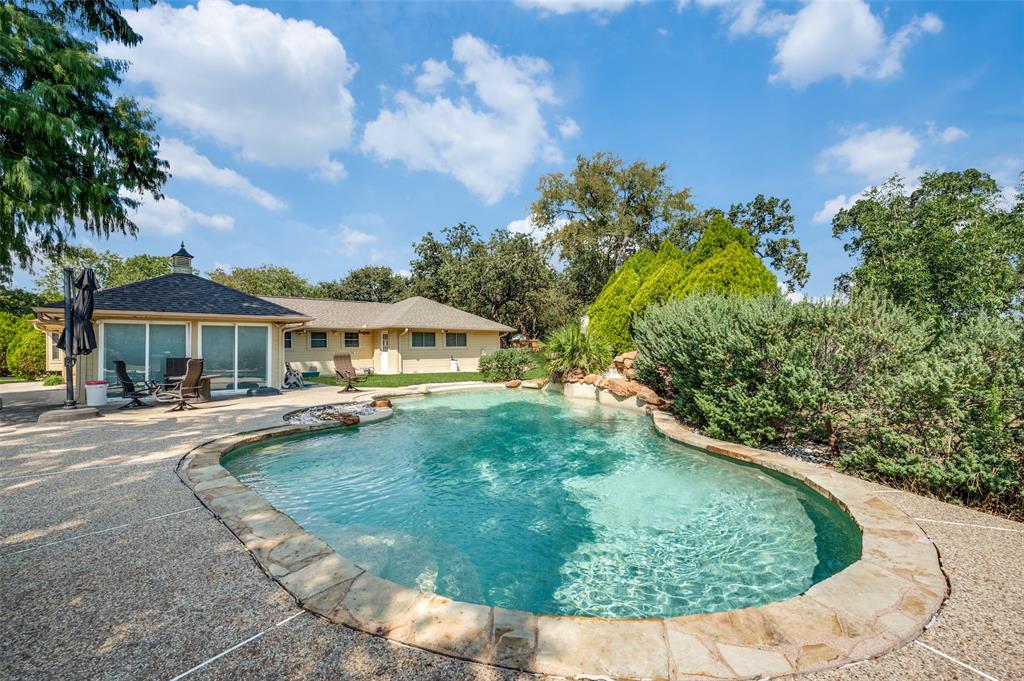 6417 Silver Wind Court Arlington, TX 76016 - Photo 4 of 18 a view of a house with swimming pool and sitting area