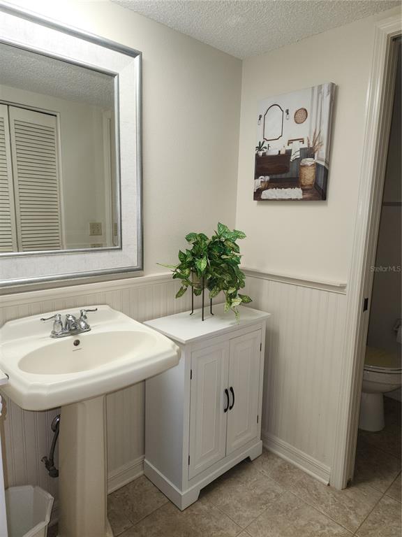 6503 Stone River Road, Unit 109 Bradenton, FL 34203 - Photo 12 of 39 a bathroom with a sink and a mirror