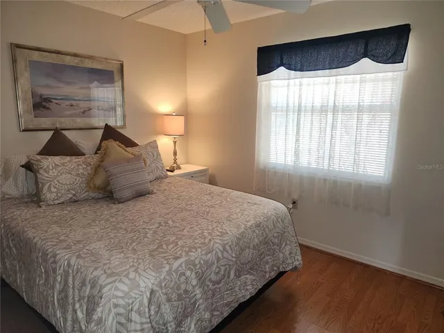 a bathroom with a sink mirror and toilet