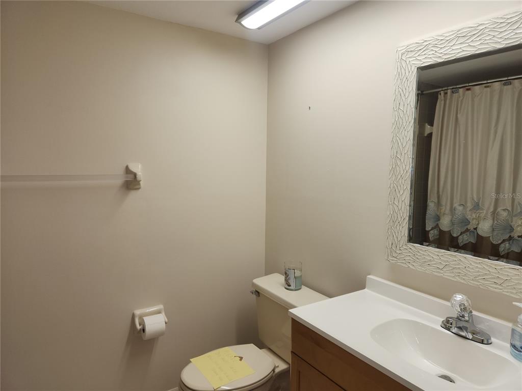6503 Stone River Road, Unit 109 Bradenton, FL 34203 - Photo 16 of 39 a bathroom with a sink mirror and toilet