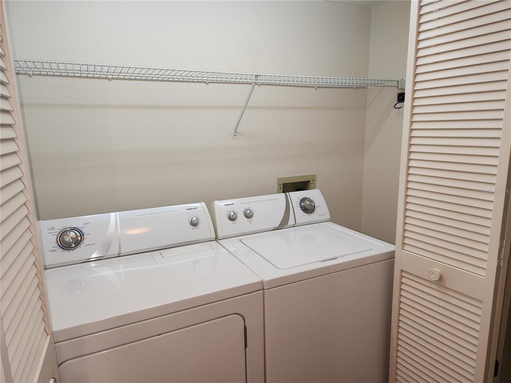 6503 Stone River Road, Unit 109 Bradenton, FL 34203 - Photo 19 of 39 a utility room with dryer and washer