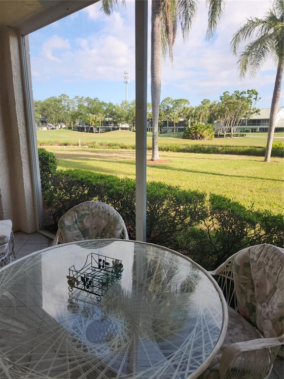 6503 Stone River Road, Unit 109 Bradenton, FL 34203 - Photo 20 of 39 a view of a swimming pool and a yard