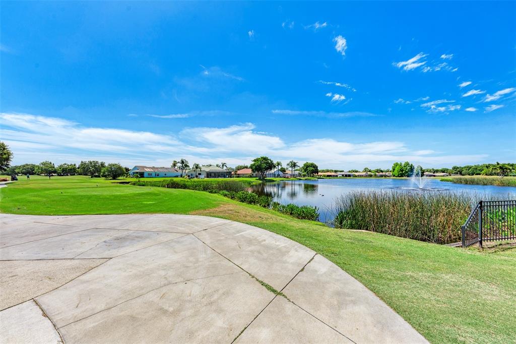 6503 Stone River Road, Unit 109 Bradenton, FL 34203 - Photo 39 of 39 a view of a lake with a big yard