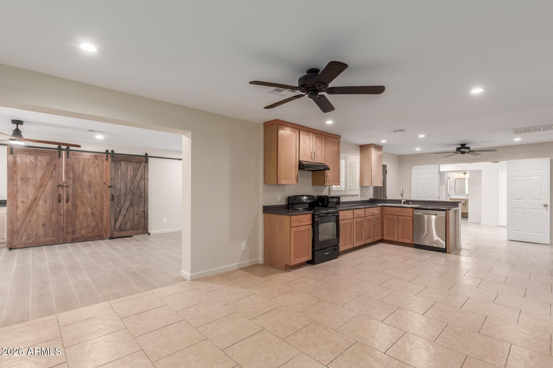 1628 East Del Rio Drive Tempe, AZ 85282 - Photo 7 of 32 a large kitchen with a large counter top appliances and cabinets