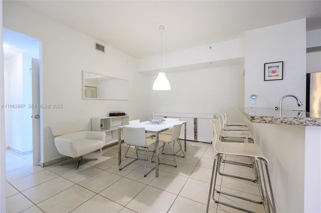 a living room with furniture and a chair