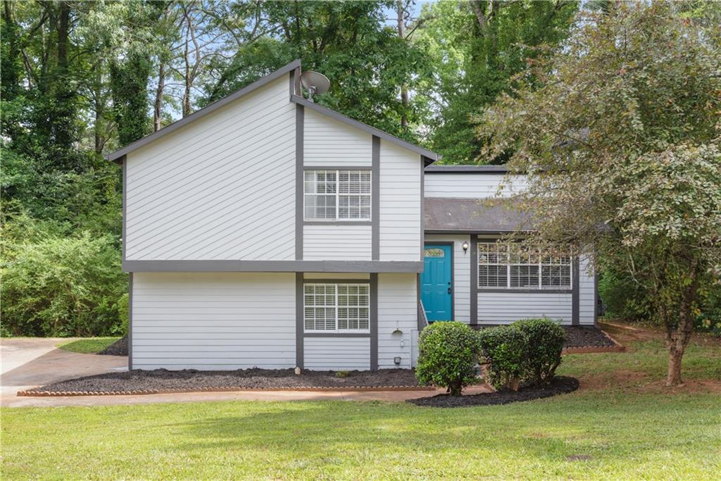 3457 Newberry Downs Lane Decatur, GA 30034 - Photo 1 of 1 a front view of a house with a yard