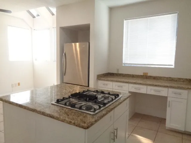 a kitchen with a stove and a sink
