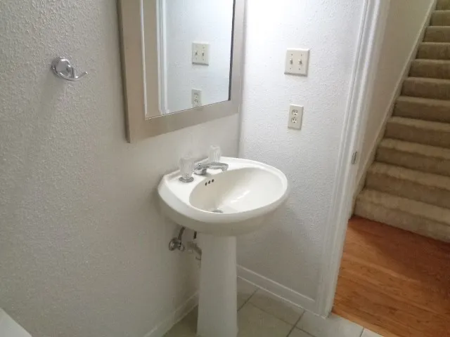 a bathroom with a sink and mirror