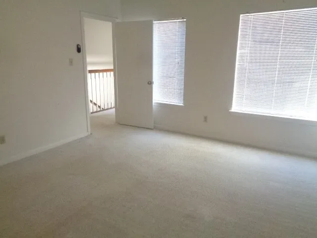 an empty room with windows