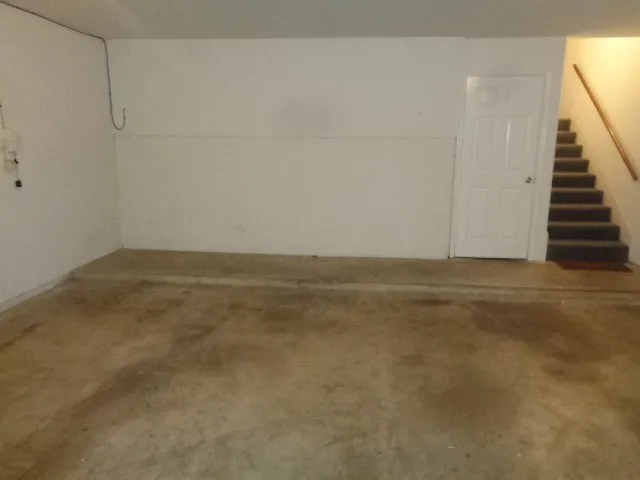 a bathroom with a shower and a sink