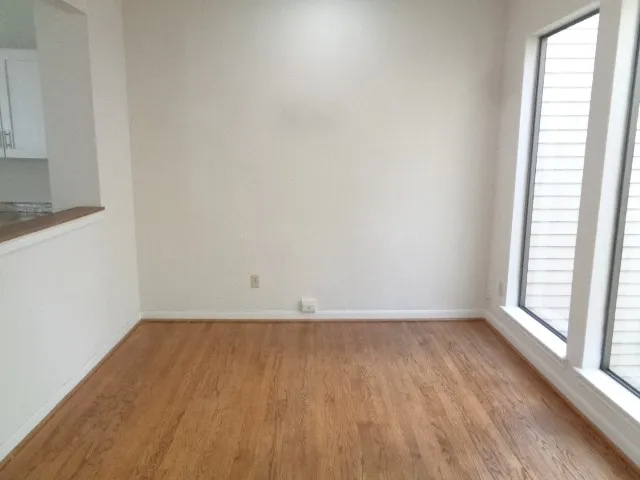 wooden floor and window in an empty room