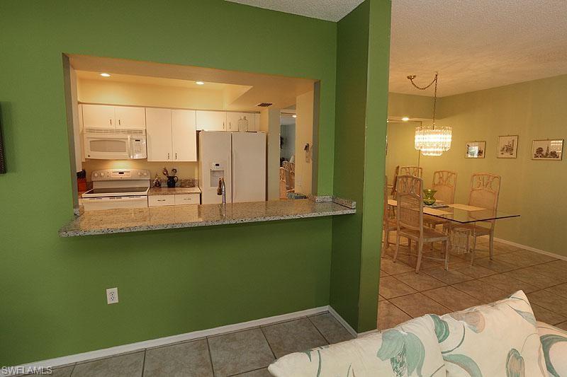 784 Willowbrook Drive, Unit 601 Naples, FL 34108 - Photo 11 of 20 a view of a living room and dining room