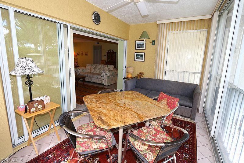 784 Willowbrook Drive, Unit 601 Naples, FL 34108 - Photo 13 of 20 a dining room with furniture and window