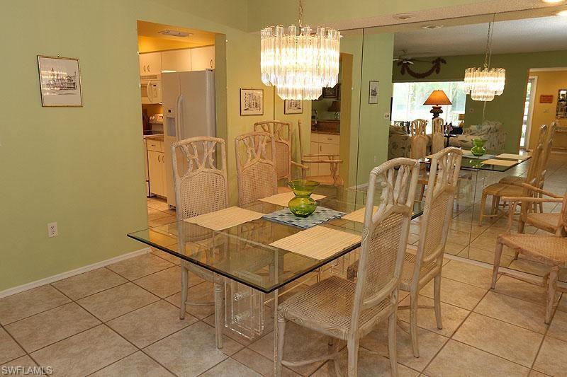 784 Willowbrook Drive, Unit 601 Naples, FL 34108 - Photo 4 of 20 a view of a dining room with furniture