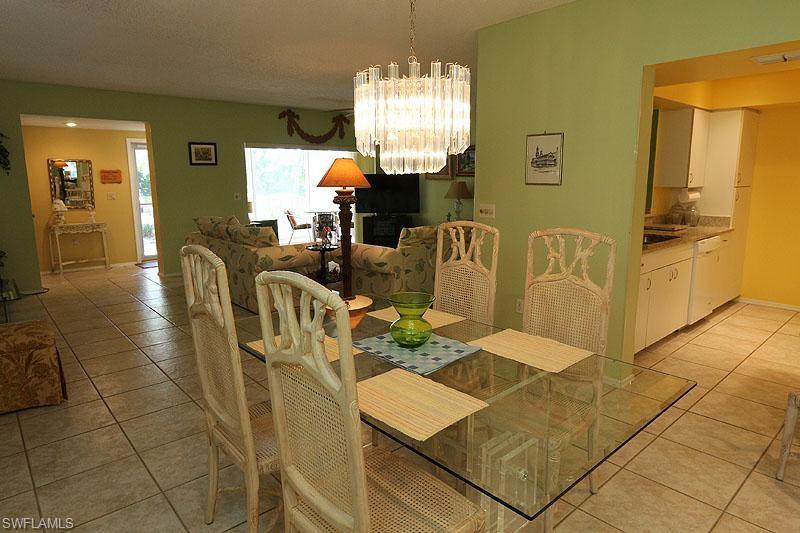 784 Willowbrook Drive, Unit 601 Naples, FL 34108 - Photo 5 of 20 a view of a dining room with furniture