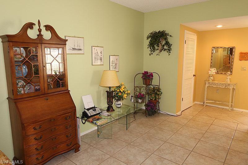 784 Willowbrook Drive, Unit 601 Naples, FL 34108 - Photo 6 of 20 a view of room with window and furniture
