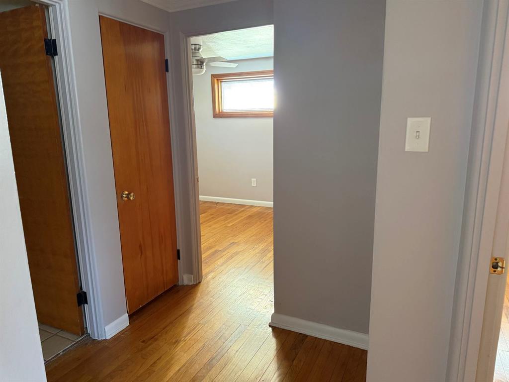 27 Corbett Avenue Irwin, PA 15642 - Photo 17 of 39 an empty room with wooden floor and closet