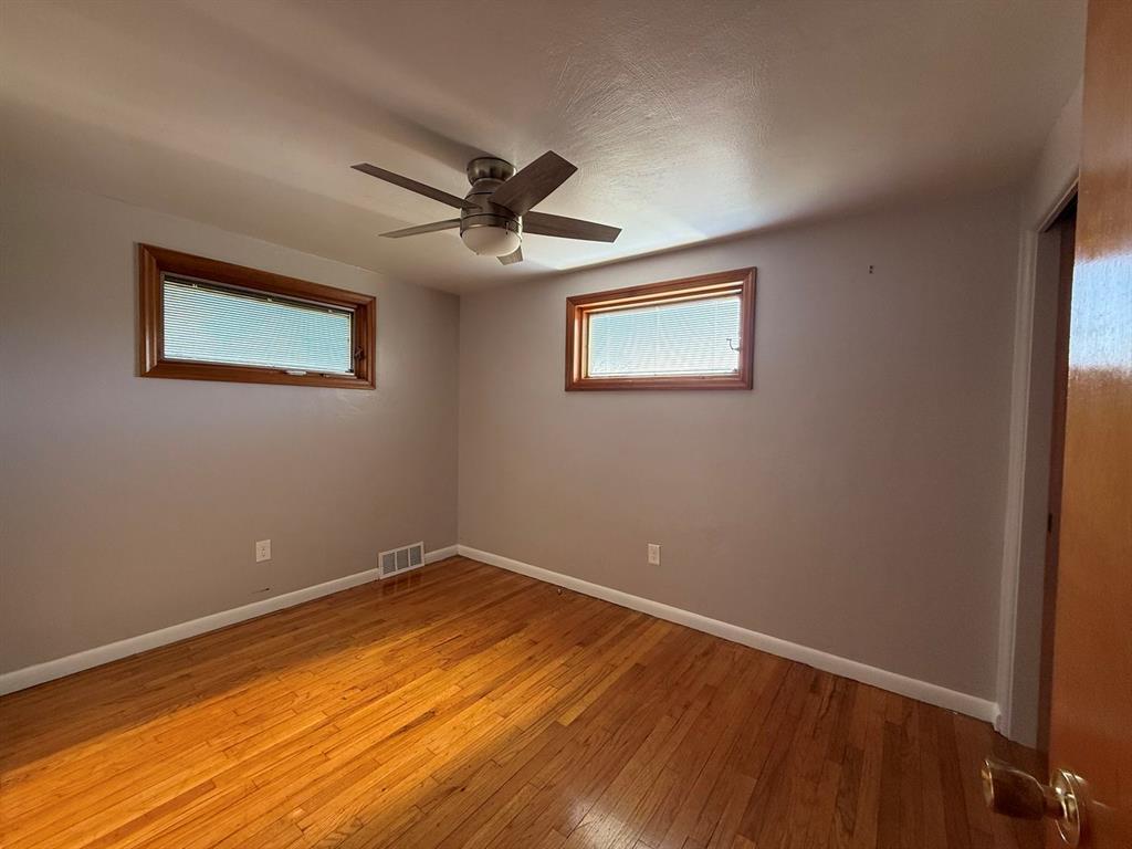 27 Corbett Avenue Irwin, PA 15642 - Photo 19 of 39 a view of empty room with wooden floor