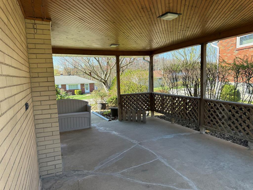 27 Corbett Avenue Irwin, PA 15642 - Photo 36 of 39 a view of a porch with wooden floor and outdoor space