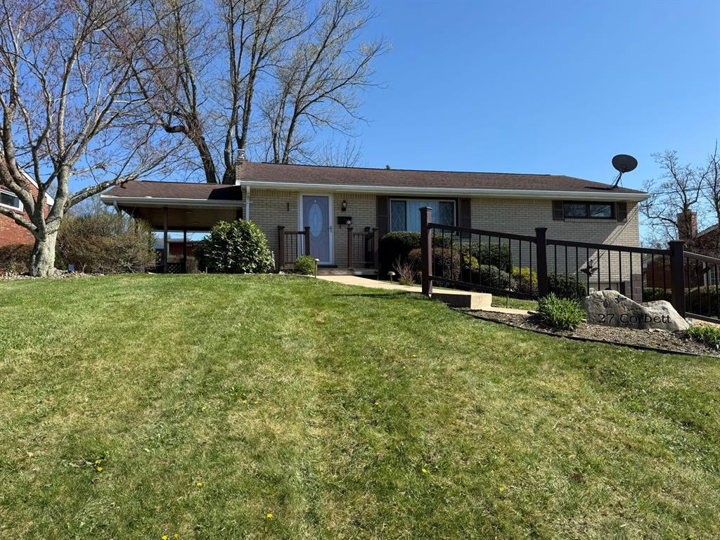 27 Corbett Avenue Irwin, PA 15642 - Photo 38 of 39 a view of a house with a yard patio and wooden fence