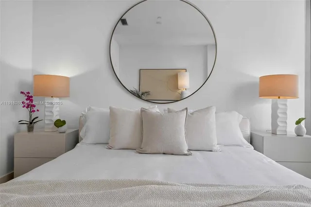 a bathroom with a sink mirror and a mirror