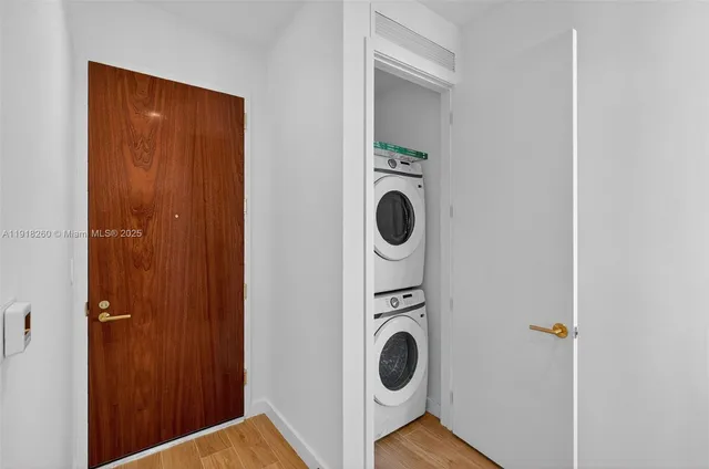 a view of a hallway with washer and dryer
