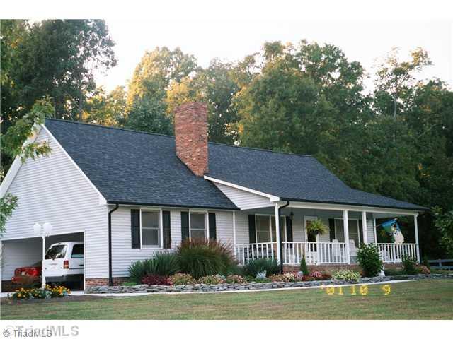 7026 Penman Road High Point, NC 27263 - Photo 1 of 16 Exterior Front. Beautiful mini farm with Rocking chair porch and mature landscaping. Low county taxes and more