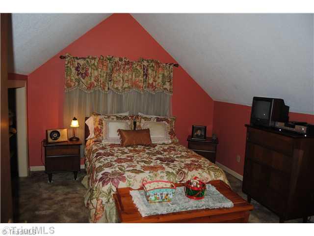 7026 Penman Road High Point, NC 27263 - Photo 11 of 16 2nd Bedroom. upstairs bedroom offers great closet and space.