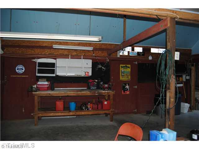 7026 Penman Road High Point, NC 27263 - Photo 15 of 16 Stable/Barn. Another view of stalls/barn