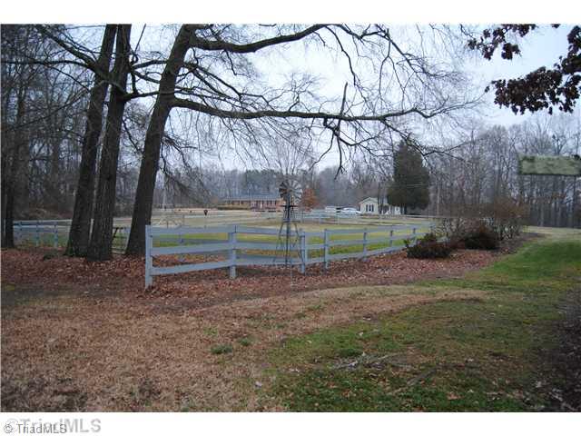 7026 Penman Road High Point, NC 27263 - Photo 16 of 16 Stable/Barn. Fenced pasture area beside of home