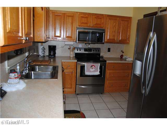7026 Penman Road High Point, NC 27263 - Photo 5 of 16 Kitchen. Check out those beautiful cabinets all appliances will remain.