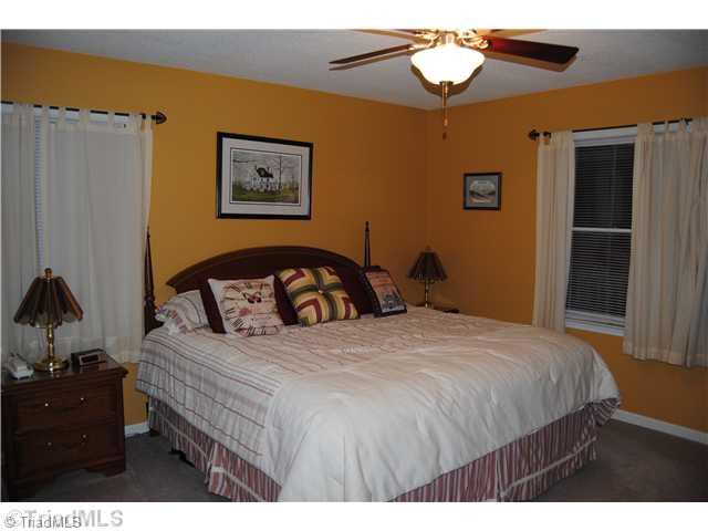 7026 Penman Road High Point, NC 27263 - Photo 9 of 16 Master Bedroom. Large main level master offers room for king size bed and his/her closets.