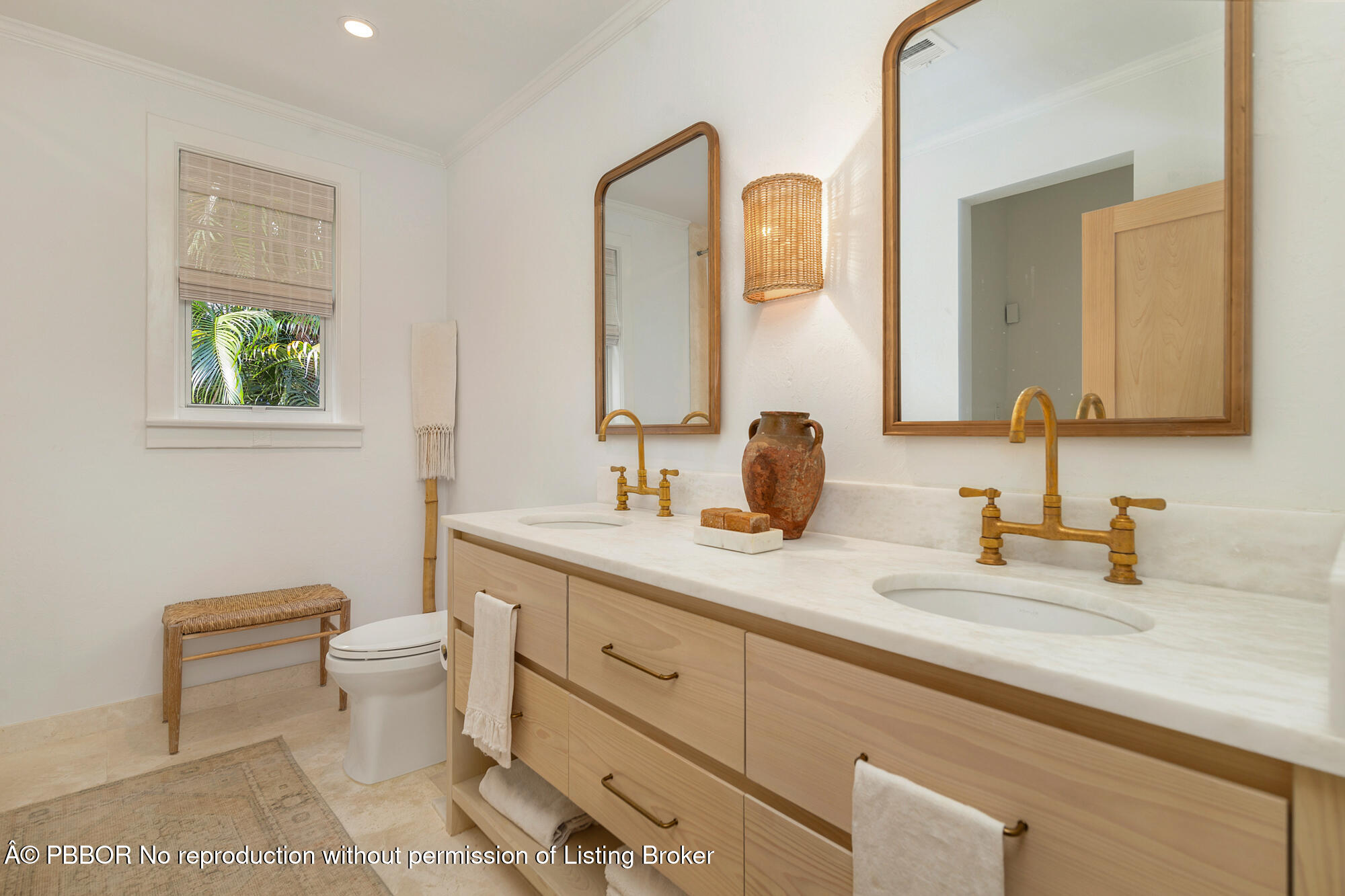 746 Upland Road West Palm Beach, FL 33401 - Photo 10 of 26 a bathroom with a toilet sink and mirror