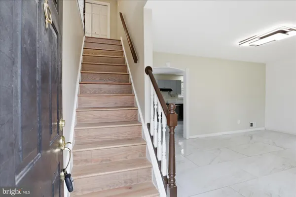 a view of entryway with wooden floor