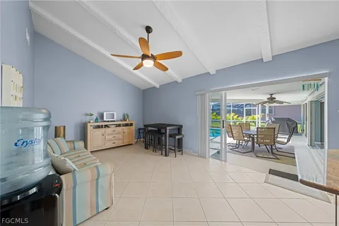 a room with lots of tables and large windows