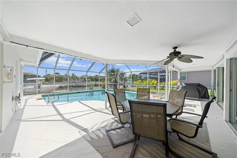 a view of a backyard with sitting area